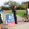 Image of student walking bike at UA Mall